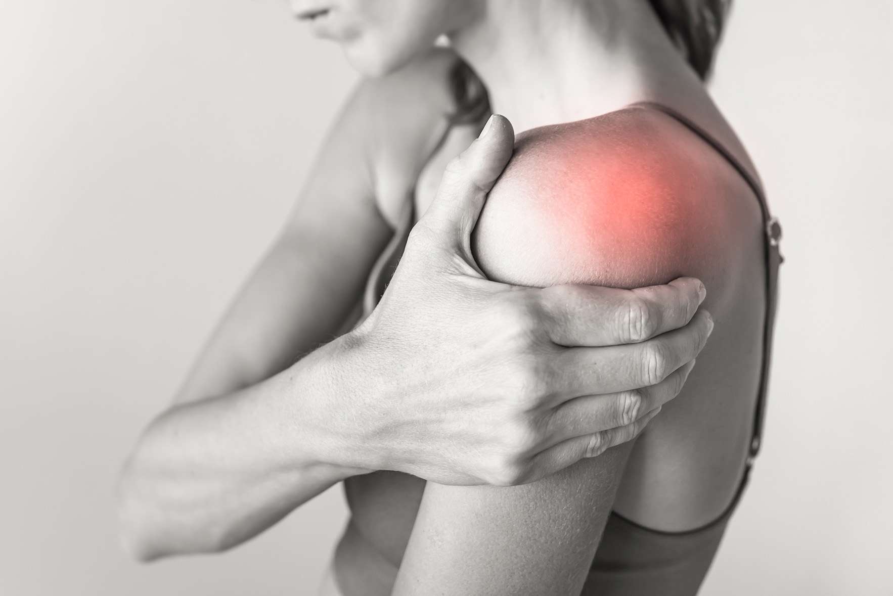 woman with pain in their shoulder joint